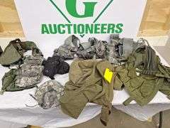 Four tactical vests, duffelbag and drop leg holster