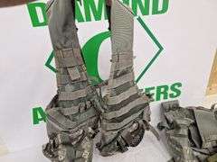 Four tactical vests, duffelbag and drop leg holster