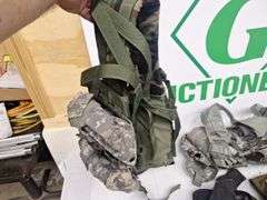 Four tactical vests, duffelbag and drop leg holster