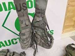 Four tactical vests, duffelbag and drop leg holster