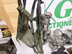 Four tactical vests, duffelbag and drop leg holster