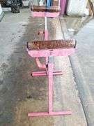 Two metal rolling stands (red)both one money