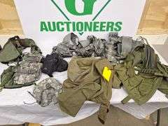 Four tactical vests, duffelbag and drop leg holster