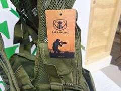 Four tactical vests, duffelbag and drop leg holster