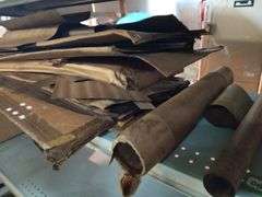 Large Assortment of Rolls and Sheets of Wood Veneer