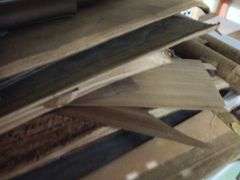 Large Assortment of Rolls and Sheets of Wood Veneer