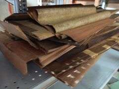 Large Assortment of Rolls and Sheets of Wood Veneer