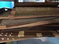 Large Assortment of Rolls and Sheets of Wood Veneer