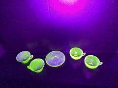 (4) Uranium Glass Teacups, (1) Uranium Glass Saucer, Pink Depression Glass "Old Colony" Vase, and Cr