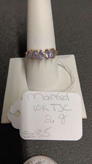 Marked 10KT TJC w/amethyst color stones (Size 8.5 2gr.)