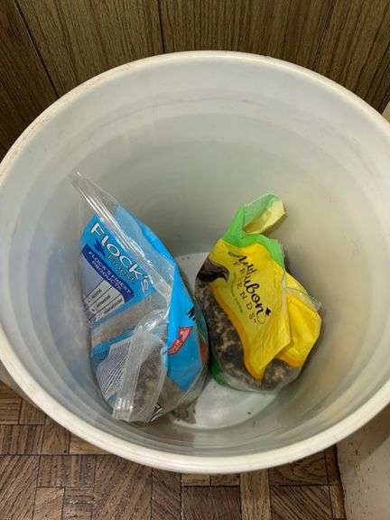 Bird seed in bucket • Laundry room