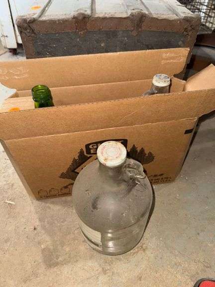 Glass gallon jugs • Basement