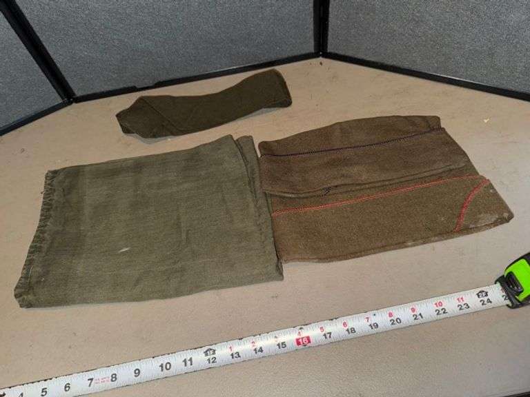 Military hats, tie and bag • Living room