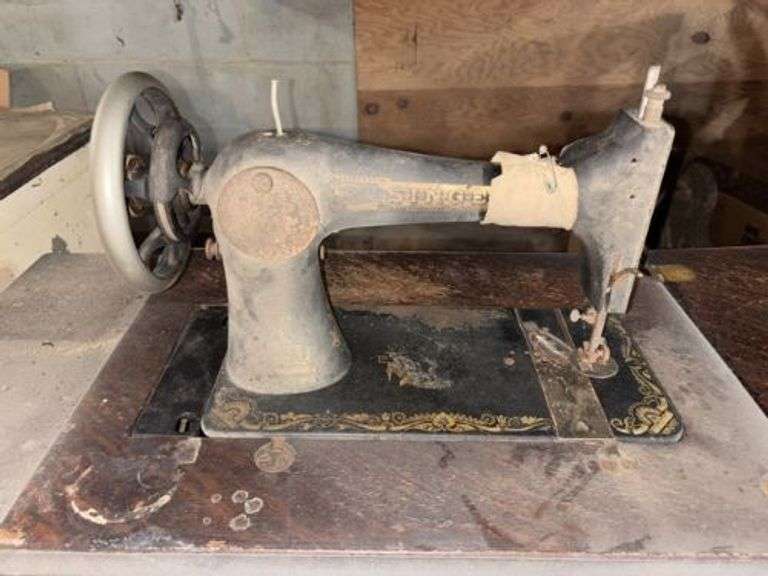 Singer sewing machine in cabinet • Basement •  ( Click for More Photos )