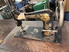 Singer sewing machine in cabinet • Basement •  ( Click for More Photos )