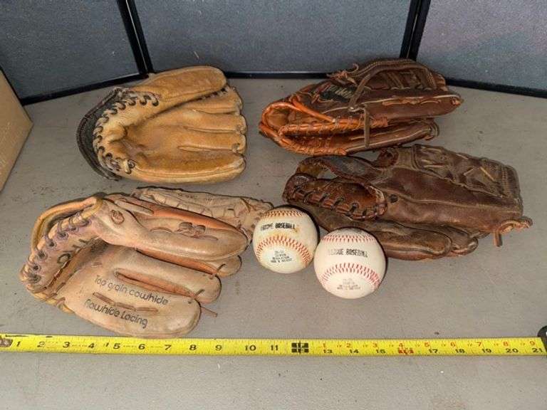 Baseball gloves and baseballs • Garage