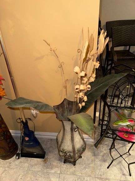 Faux plant decor in vase • Basement
