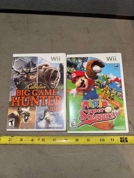 Wii Cabelas big game hunter and mario super slugger games • Dining room