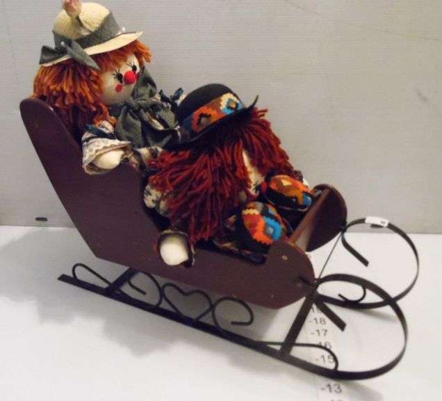 Two Clown Dolls In Wood Sled