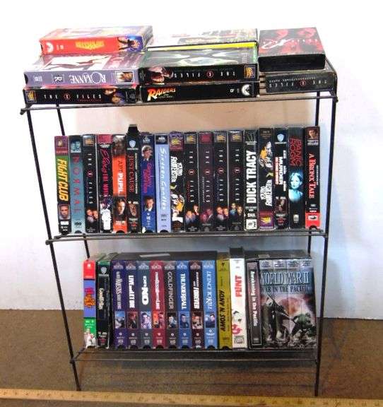 VHS Tapes On Wire Storage Rack - Dunker Auction