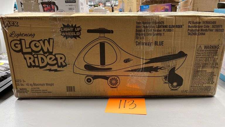 LIGHTNING GLOW RIDER KIDS RIDE ON IN BOX - Earl's Auction Company