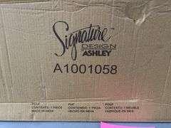 ASHLEY SIGNATURE DESIGN POUF IN BOX