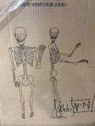 2PC ANIMATED SKELETON DECOR IN BOX - BRONZE