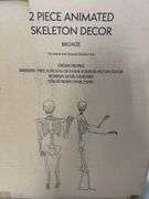 2PC ANIMATED SKELETON DECOR IN BOX - BRONZE