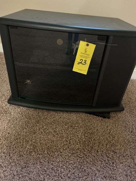 BLACK WITH GLASS DOOR SWIVEL TV STAND-19X28.5X20--located upstairs