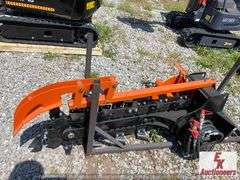 UNUSED WALK BEHIND SKIDSTEER TRENCHER