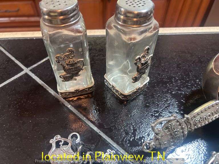 UNUSED METAL MEASURING CUPS AND SPOONS AND SALT AND PEPPER SHAKERS