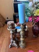 CANDLE STICKS AND CANDLES AND VASE OF ARTIFICIAL FLOWERS