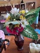 CANDLE STICKS AND CANDLES AND VASE OF ARTIFICIAL FLOWERS