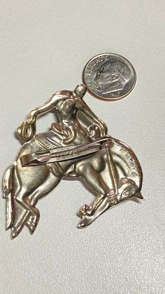 Vintage silvertone cowboy on bucking bronco pin