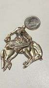 Vintage silvertone cowboy on bucking bronco pin
