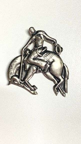 Vintage silvertone cowboy on bucking bronco pin
