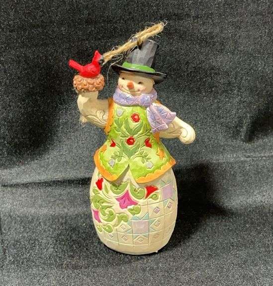 Jim Shore Heartwood Creek snowman ornament with a cardinal in a nest.