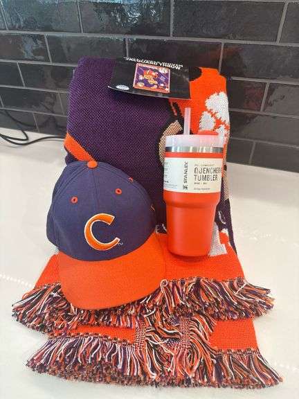 Stanley Cup and Clemson blanket and hat
