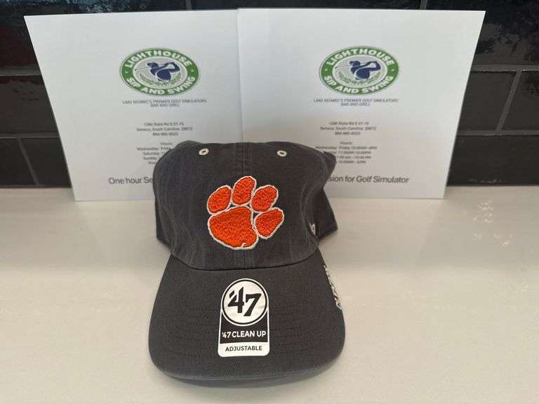 Sip and Swing Golf Simulator and Clemson hat