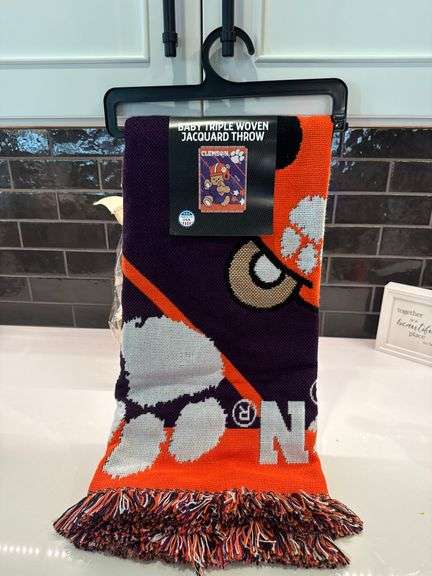 Stanley Cup and Clemson blanket and hat