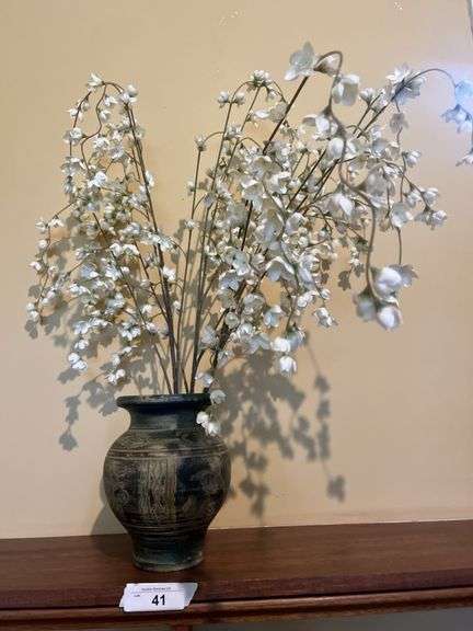 Vase with artificial flowers