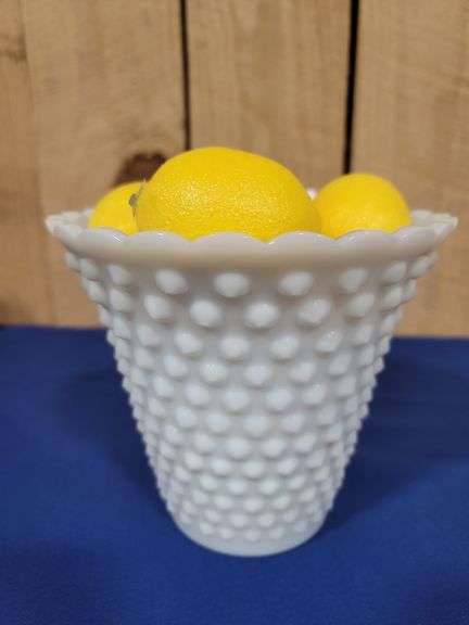 Vase and artificial lemons.