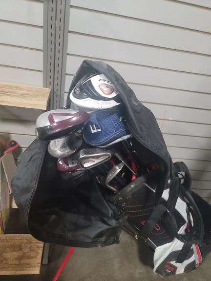 Golf clubs plus rolling cart.