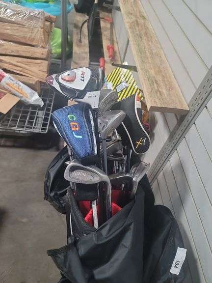 Golf clubs plus rolling cart.