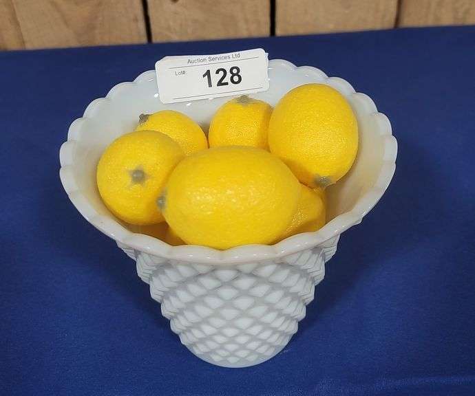 Vase and artificial lemons.