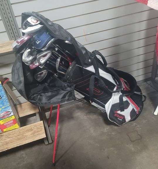 Golf clubs plus rolling cart.
