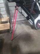 Golf clubs plus rolling cart.