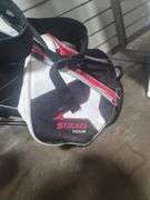 Golf clubs plus rolling cart.