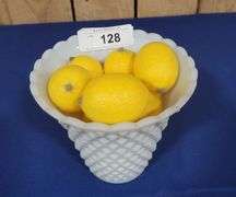 Vase and artificial lemons.