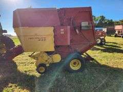 NH 853 Round Baler Used this season Air bags good, pickup good condition with control box, electric 